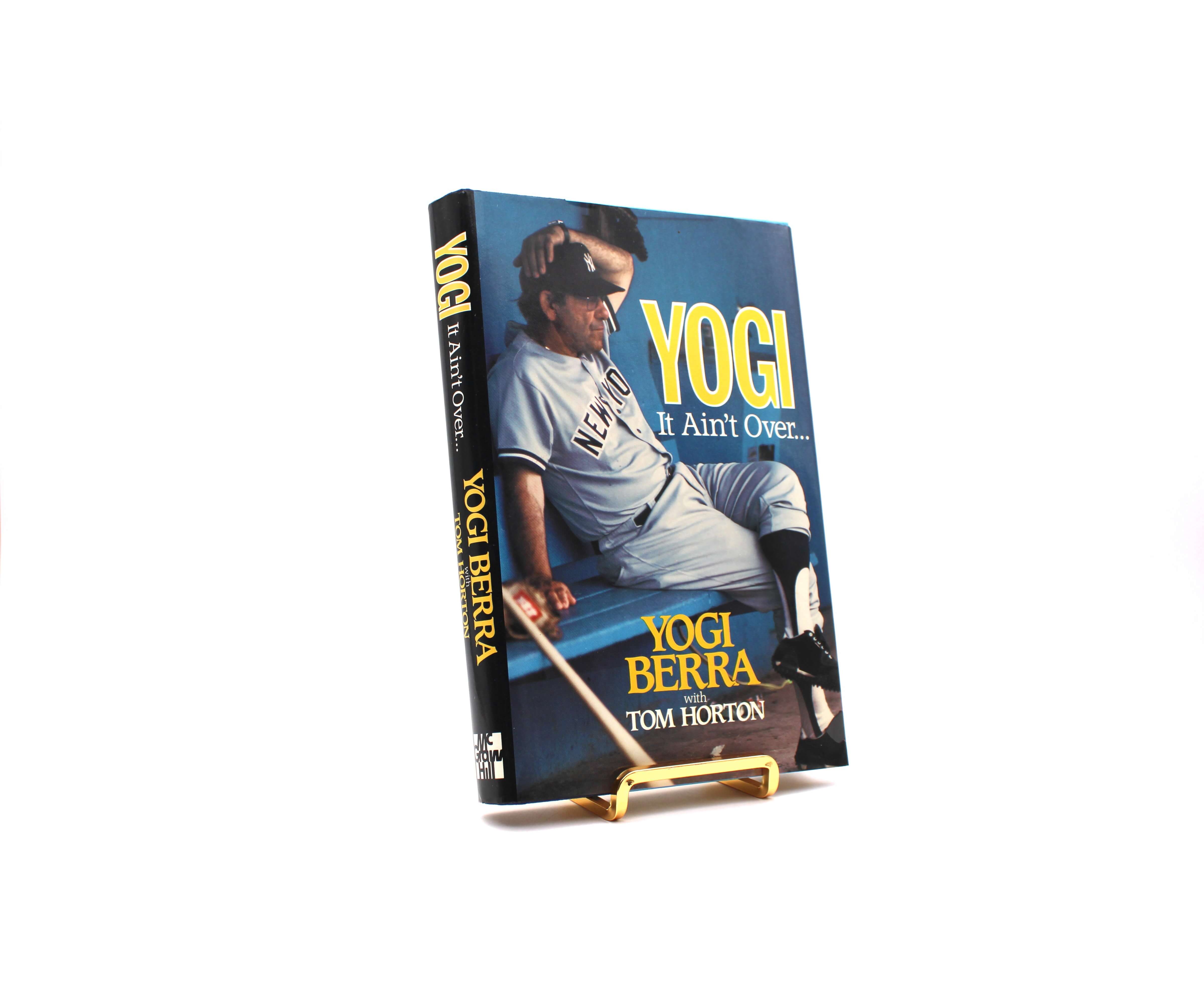 Yogi It Ain’t over. Inscribed by Yogi Berra. First Edition, First Printing. McGraw Hill Publishing. New York, 1989.