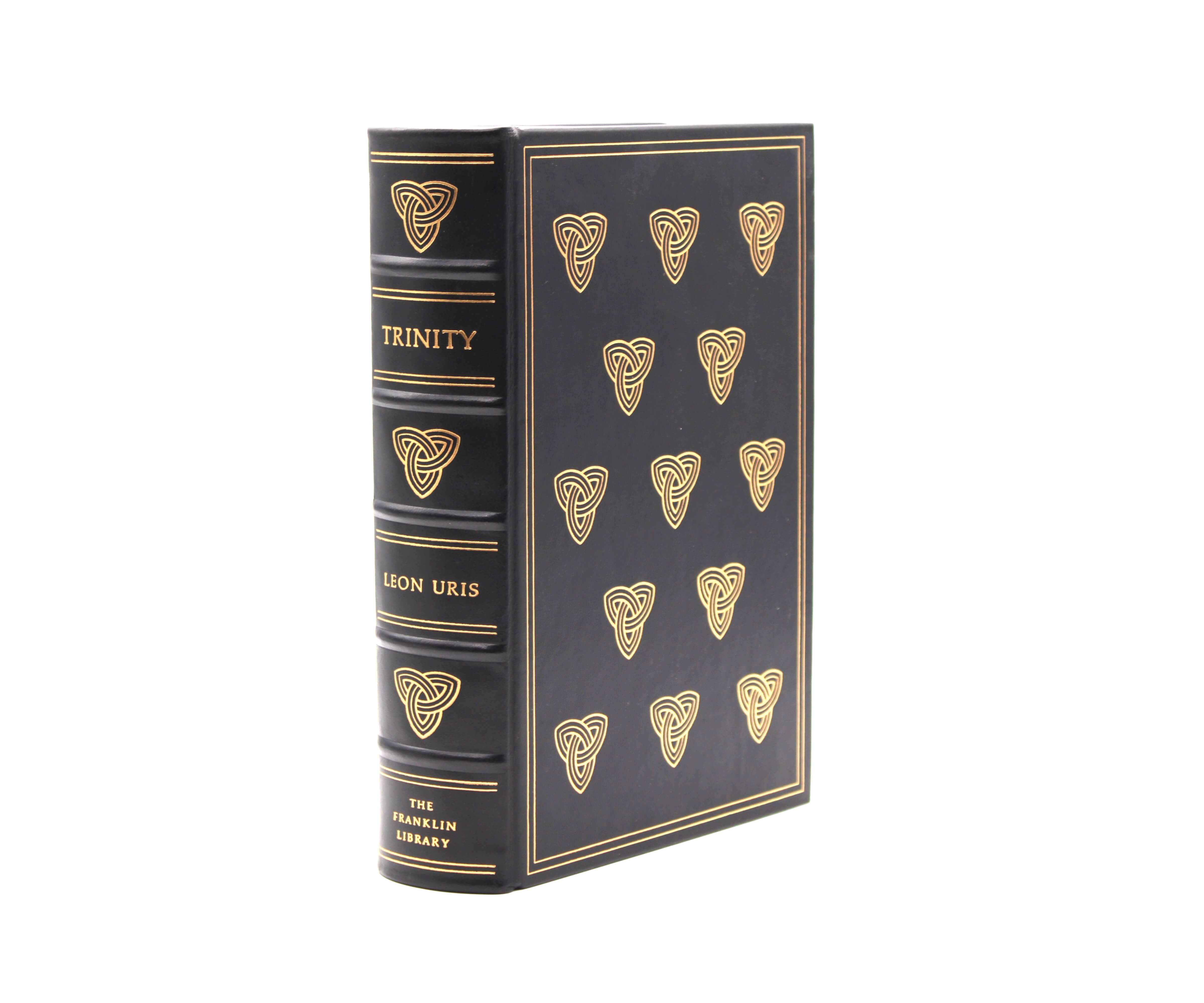 Trinity. By Leon Uris. Illustrated by Herbert Tauss. Limited First Edition. Franklin Library. Franklin Center, 1976.